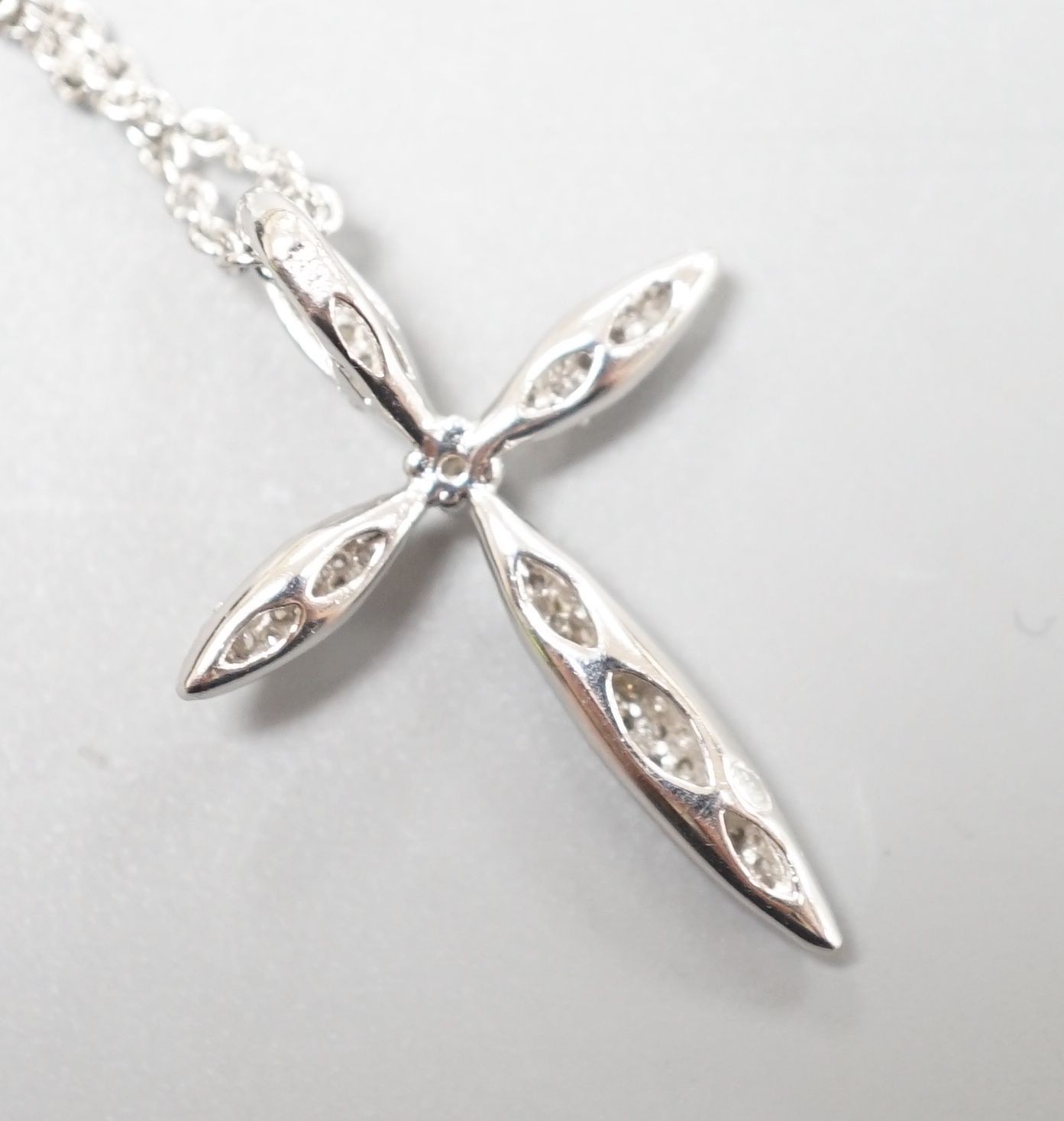 A modern 18ct white gold and pave set diamond cross pendant, 26mm, on an 18ct white gold fine link chain, 40cm, gross weight 4.9 grams